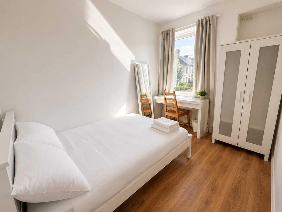 Desk, laptop workspace, free WiFi, bed sheets