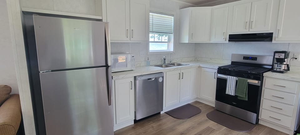 Microwave, Dishwasher, bunn coffee pot, stove and oven, refrigerator 