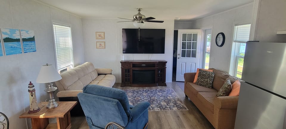 smart TV w wifi , electric fireplace, full size new mattress sofa bed