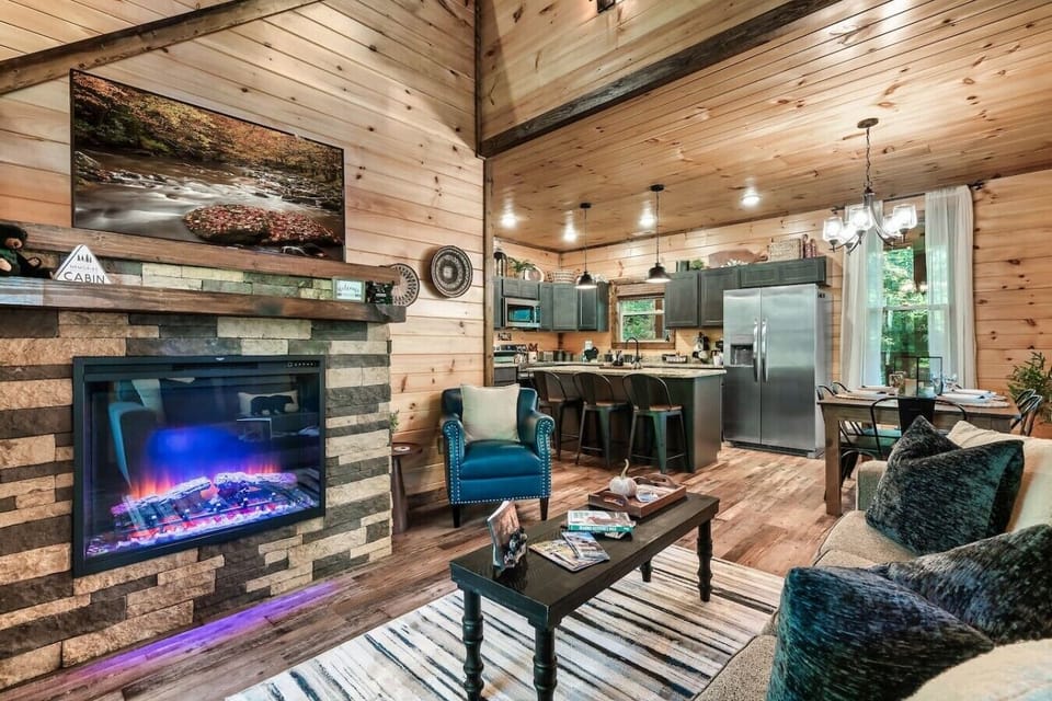Relax by the fireplace after a day of adventure while enjoying the warm rustic charm and comfortable seating for the whole group.