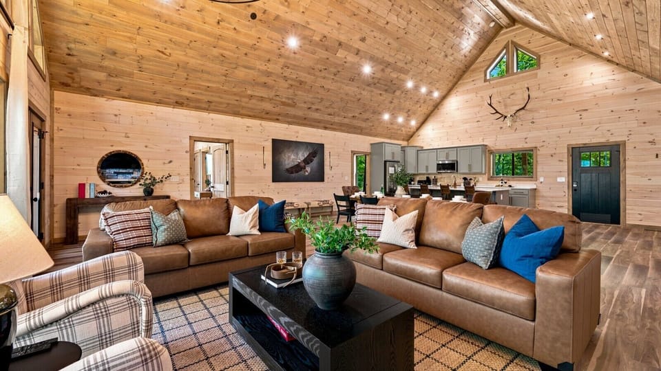 The open-concept great room offers plenty of space for everyone to gather, whether you`re sharing meals, relaxing by the fireplace, or planning the next Smoky Mountain adventure.