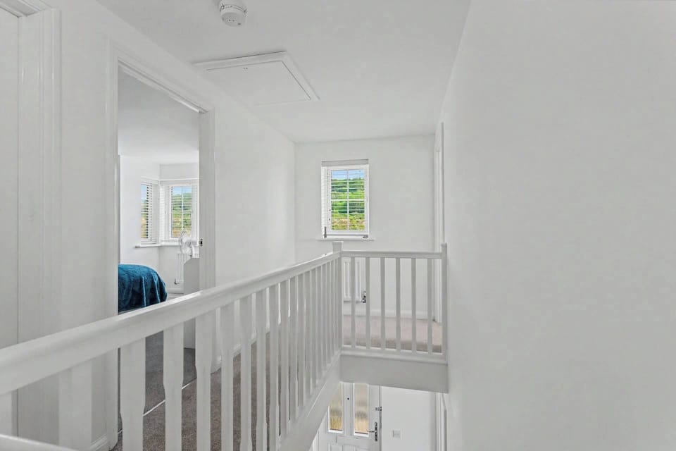 A light and welcoming upstairs landing, offering a smooth flow between the sleeping spaces and bathroom.