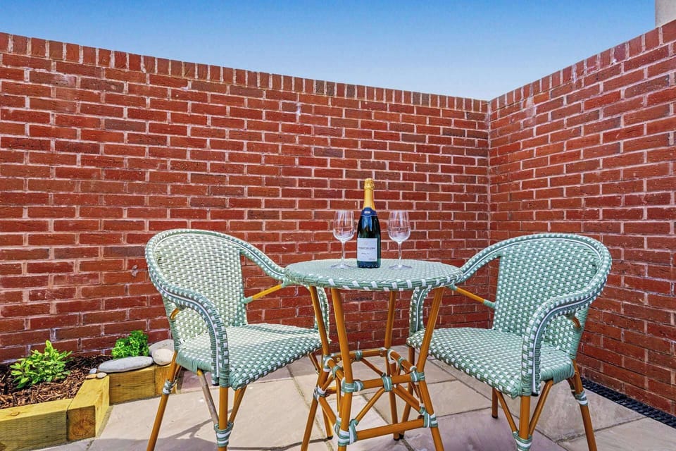 Guests can enjoy the enclosed private garden, with outdoor seating for relaxing in the fresh air.