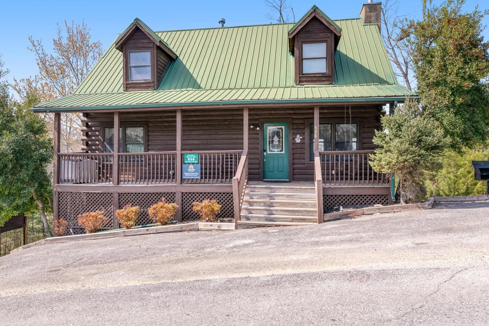 Charming cabin retreat awaits. And, enjoy mountain views from the spacious porch of this inviting log home!