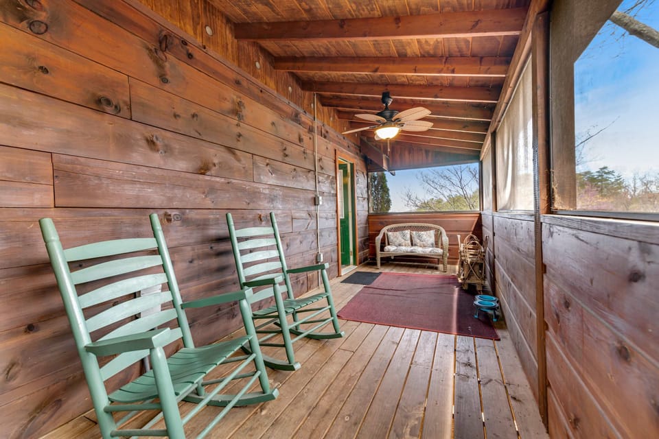 Screened-In Porch, relax in rocking chairs and enjoy nature from this charming getaway space!