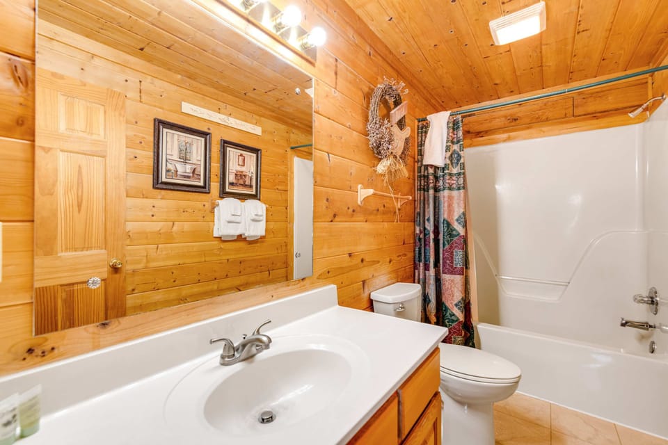 Enjoy a rustic feel with warm wood, elegant decor, and a refreshing tub!