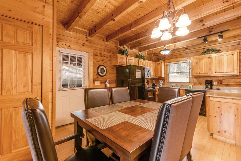 Dining Room, gather around the elegant table and enjoy meals amid charming wooden accents!