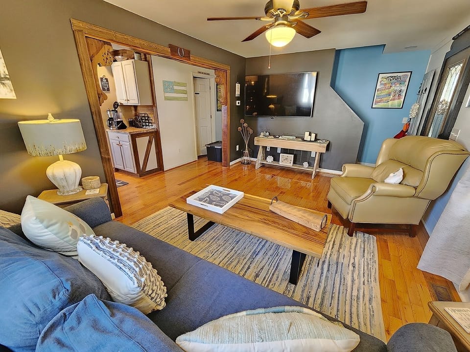 A welcoming front living room provides comfortable seating and a TV.