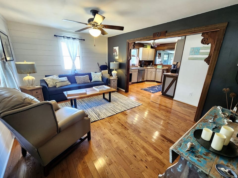 A welcoming front living room provides comfortable seating and a TV.