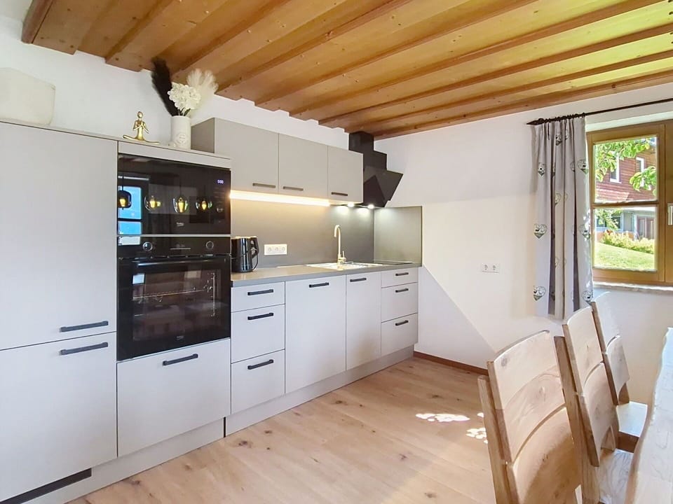 Interior Design, Kitchen, Flooring, Countertop, Wood, Furniture, Cabinetry, Floor, Ceiling, Kitchen Appliance