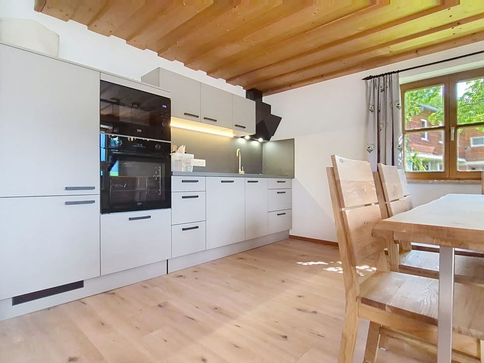 Flooring, Interior Design, Wood, Kitchen, Floor, Furniture, Wood Flooring, Countertop, Ceiling, Cabinetry
