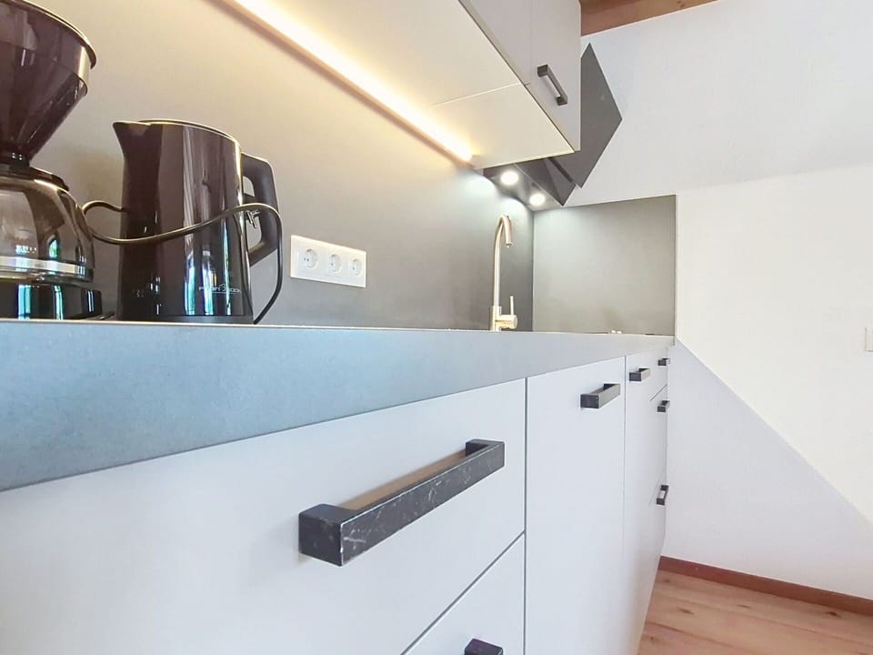 Flooring, Wood, Interior Design, Kitchen, Countertop, Floor, Cabinetry, Ceiling, Home, Light Fixture