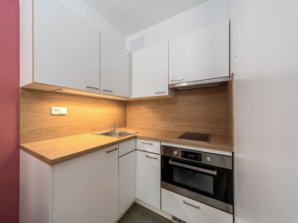 Countertop, Interior Design, Kitchen, Wood, Cabinetry, Flooring, Kitchen Appliance, Major Appliance, Floor, Furniture
