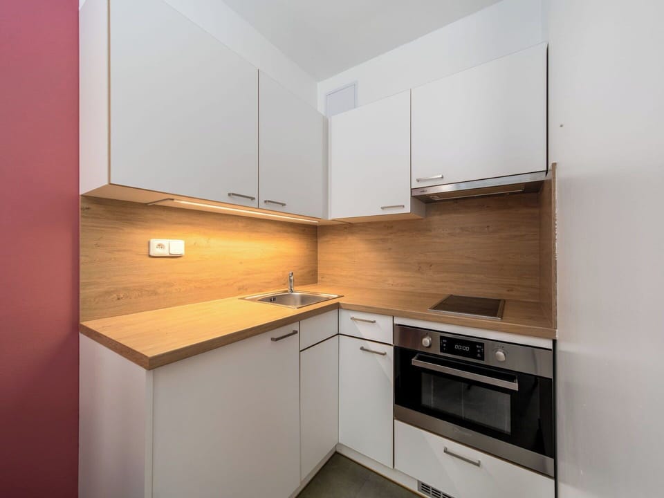 Countertop, Interior Design, Wall, Wood, Flooring, Cabinetry, Kitchen, Kitchen Appliance, Floor, Major Appliance