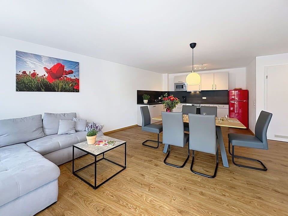 Furniture, Interior Design, Flooring, Floor, Couch, Wood, Room, Table, Living Room, Wood Flooring