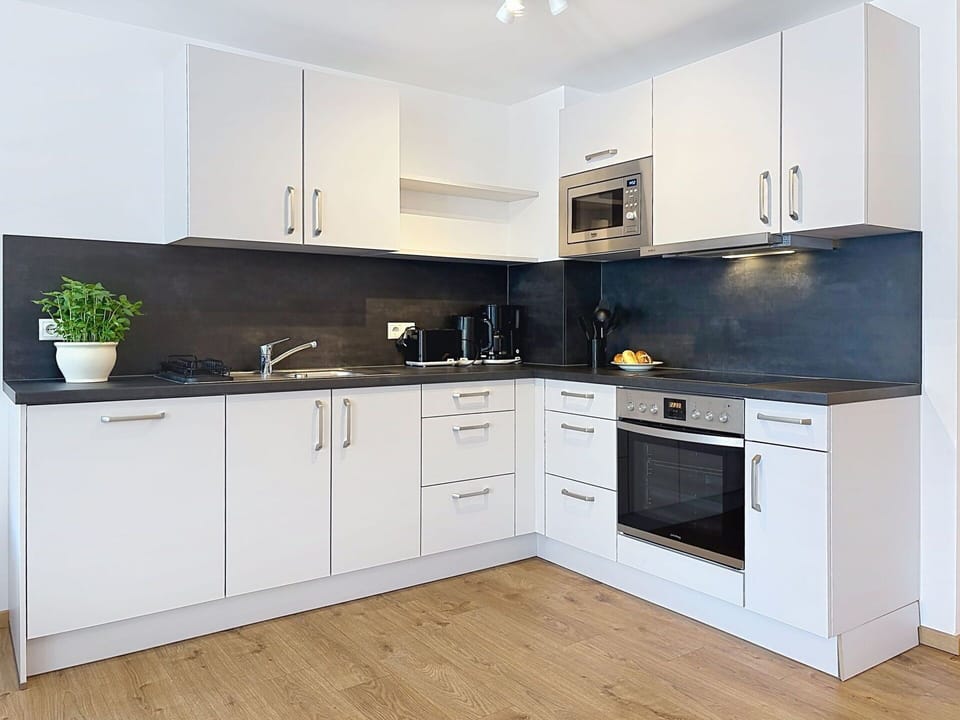 Countertop, Kitchen, Cabinetry, Kitchen Appliance, Flooring, Interior Design, Wood, Furniture, Major Appliance, Floor