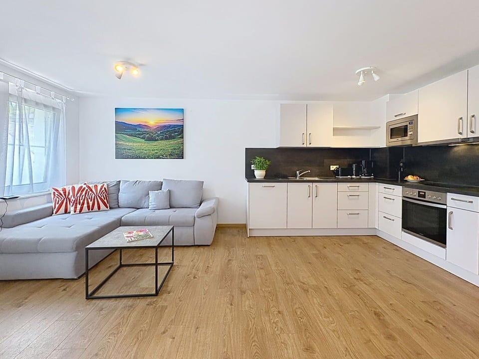 Furniture, Interior Design, Flooring, Floor, Wood Flooring, Couch, Wood, Room, Laminate Flooring, Ceiling