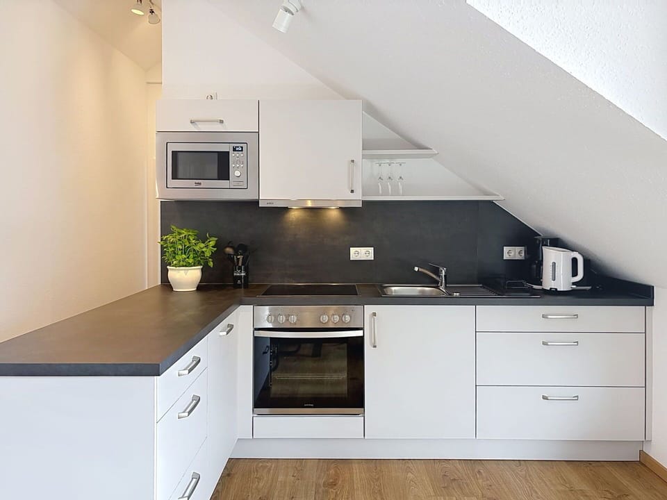 Flooring, Kitchen, Interior Design, Countertop, Floor, Cabinetry, Kitchen Appliance, Furniture, Major Appliance, Plumbing Fixture