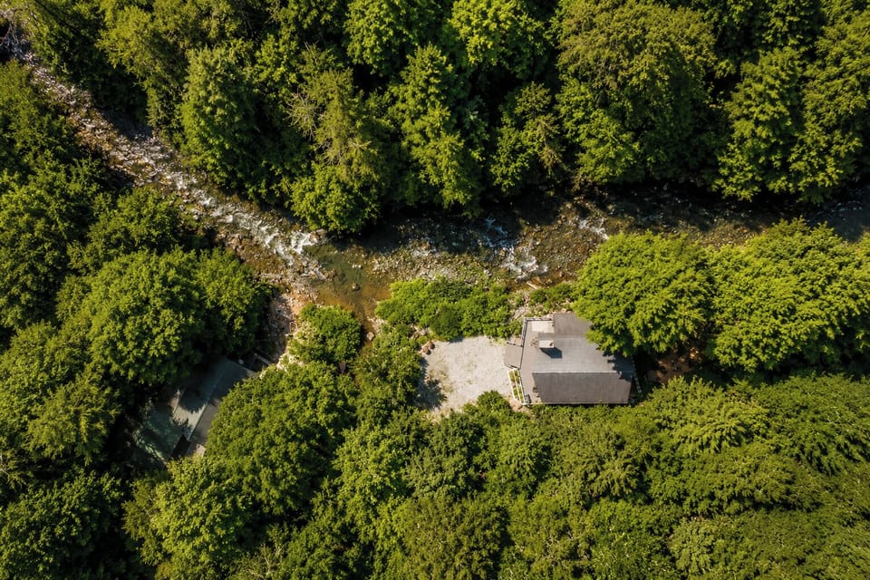 Aerial view of home and river 