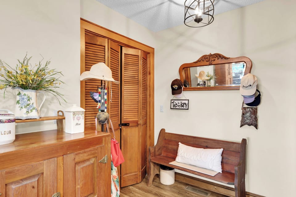 Step into this warm, welcoming entryway, featuring handy bench seating and storage — the perfect spot to kick off boots and settle in after mountain adventures.