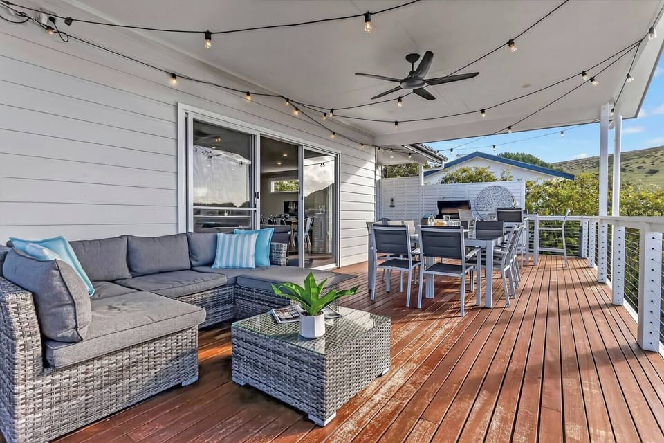 Stretch out across the expansive deck where outdoor dining, comfortable seating and elevated views create an inviting backdrop for long afternoons outdoors.