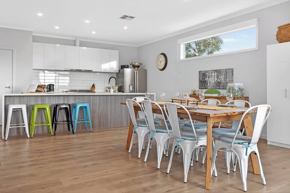 Pull up a stool at the kitchen island and enjoy a fresh coffee while conversations flow around the open-plan heart of the home.
