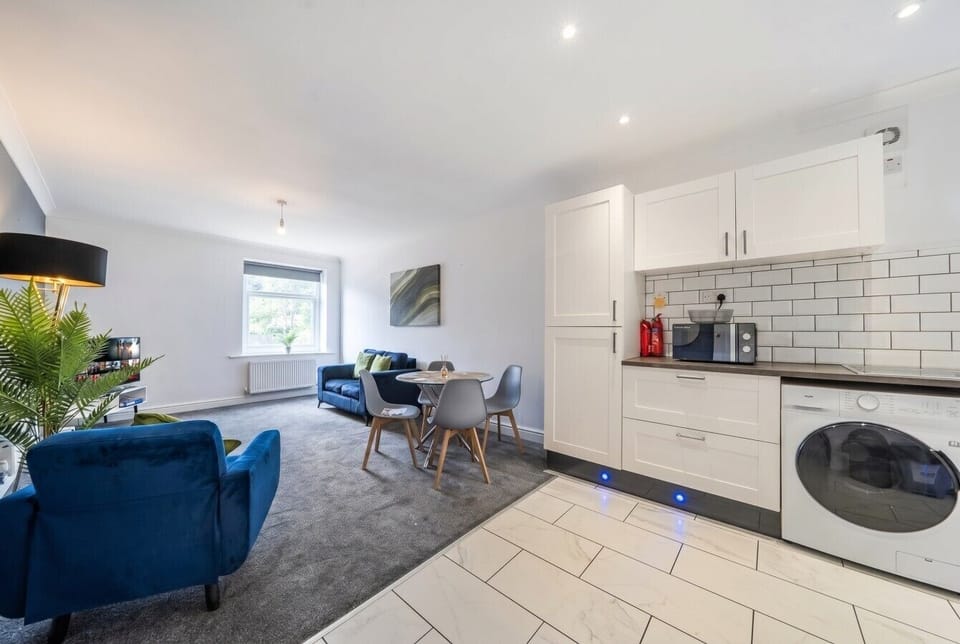 Bright open plan living and dining with a stylish kitchen at hand