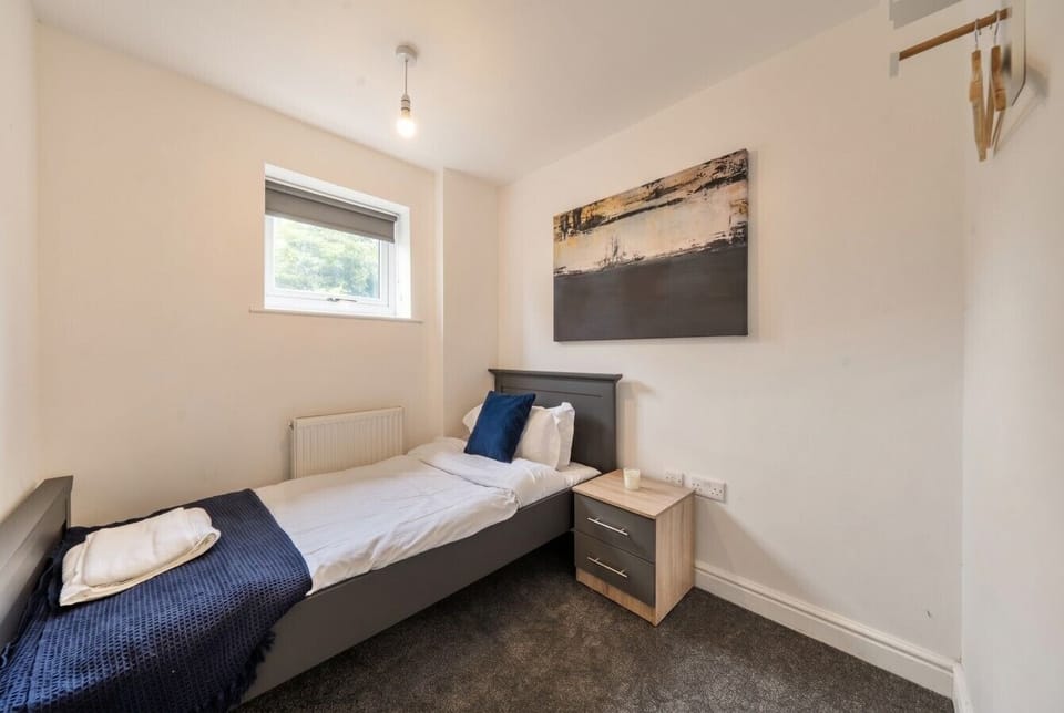 Calm single room with crisp linens, perfect for an extra guest
