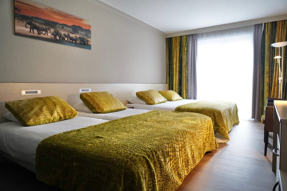 Standard Quadruple Room | In-room safe, desk, blackout drapes, free WiFi