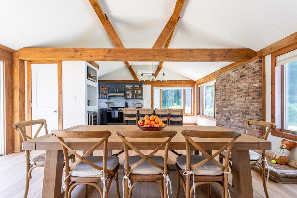 A large dining table made for shared meals and late-night conversations