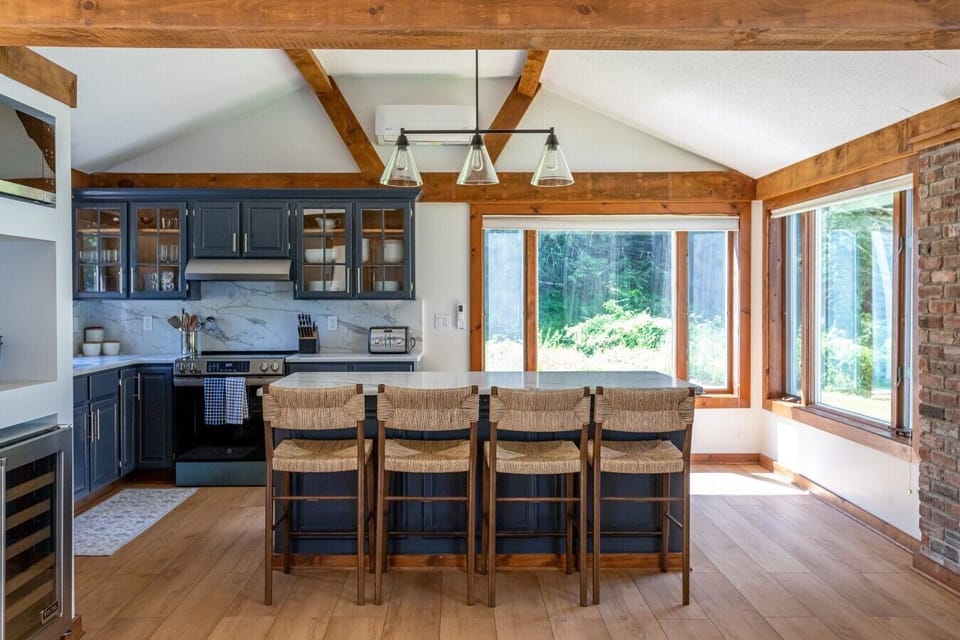 Gather around the island - this bright, welcoming kitchen is perfect for cooking, chatting, and making memories