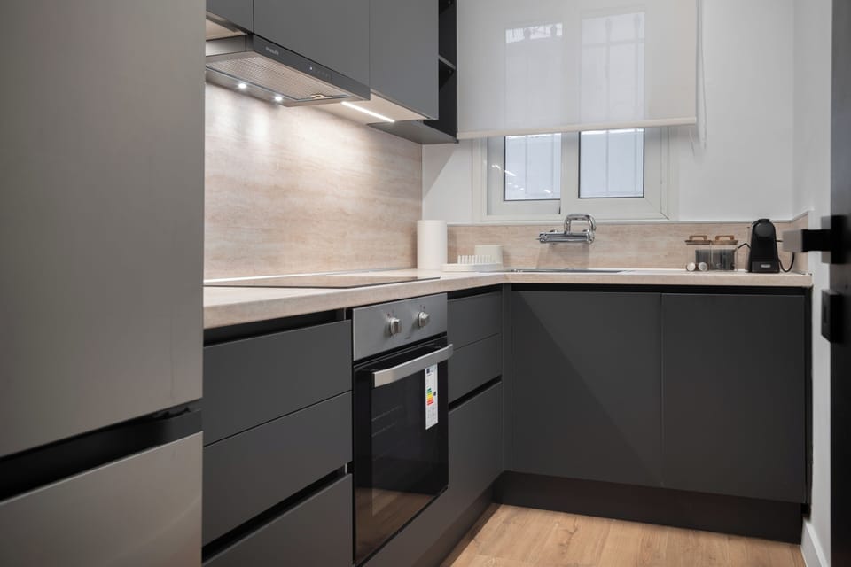 Sleek modern kitchen with stylish grey cabinetry and ample storage space.