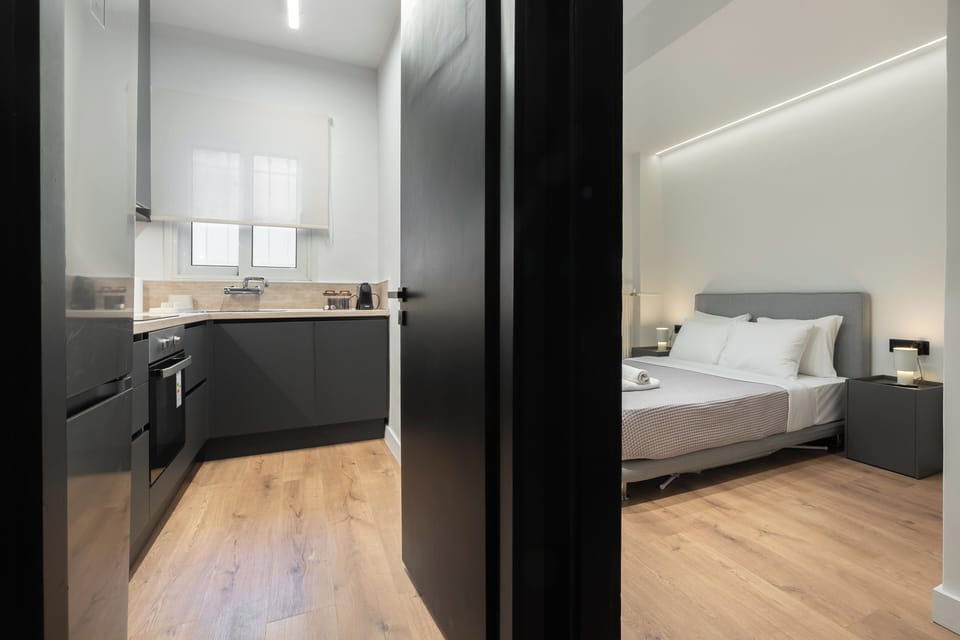 Cosy bedroom with ambient lighting and a plush double bed.