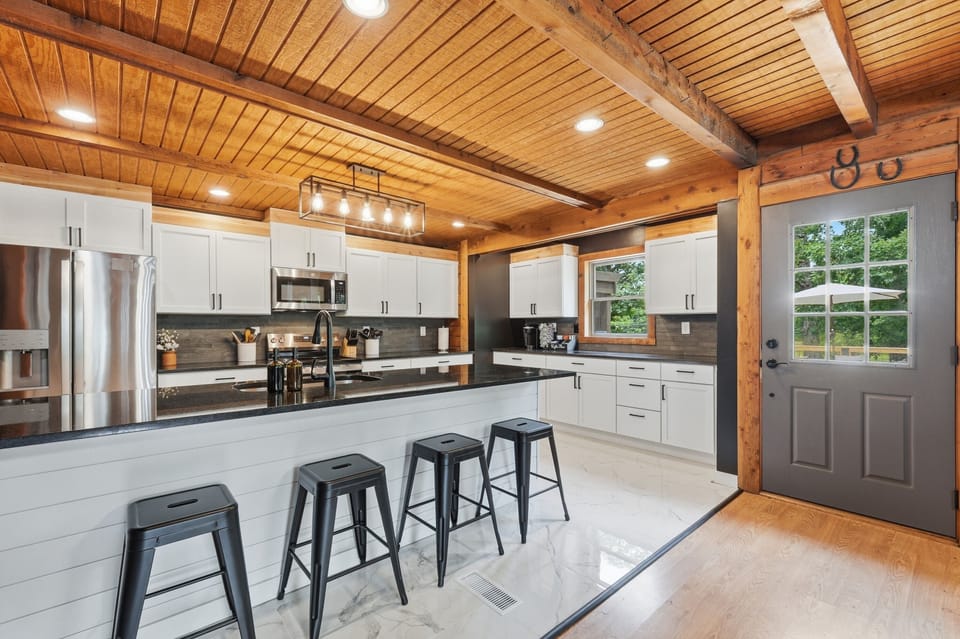 Bright rustic-modern kitchen with island seating for four