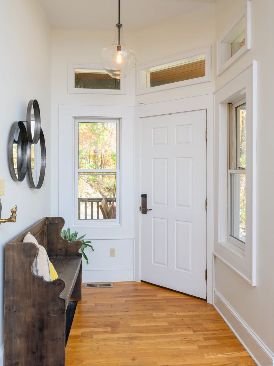 A bright, welcoming entryway with warm wood floors and natural light — the perfect first impression as you arrive.