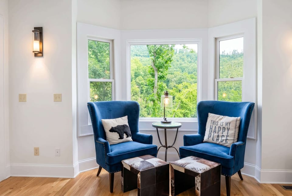 Pull up a chair in this sun-drenched nook and settle in — a cozy corner perfect for catching up or simply unwinding.
