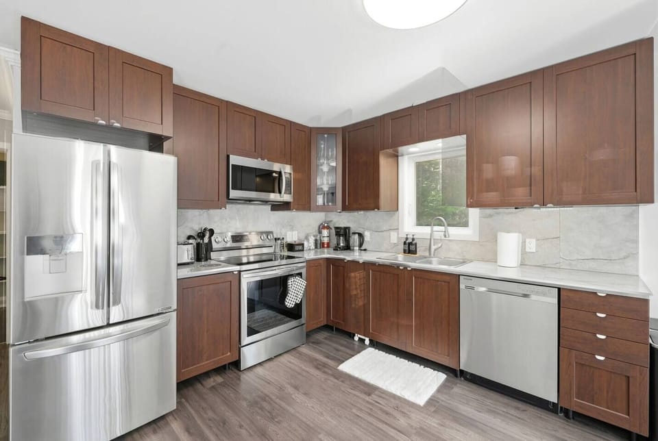 Prepare your favorite meals with ease during your stay. With full appliance access and a functional layout, this kitchen makes it simple to feed your group or grab a quick bite before heading out.