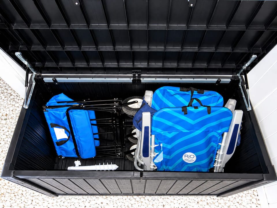 Beach-ready storage with chairs, cart, and gear for easy coastal days