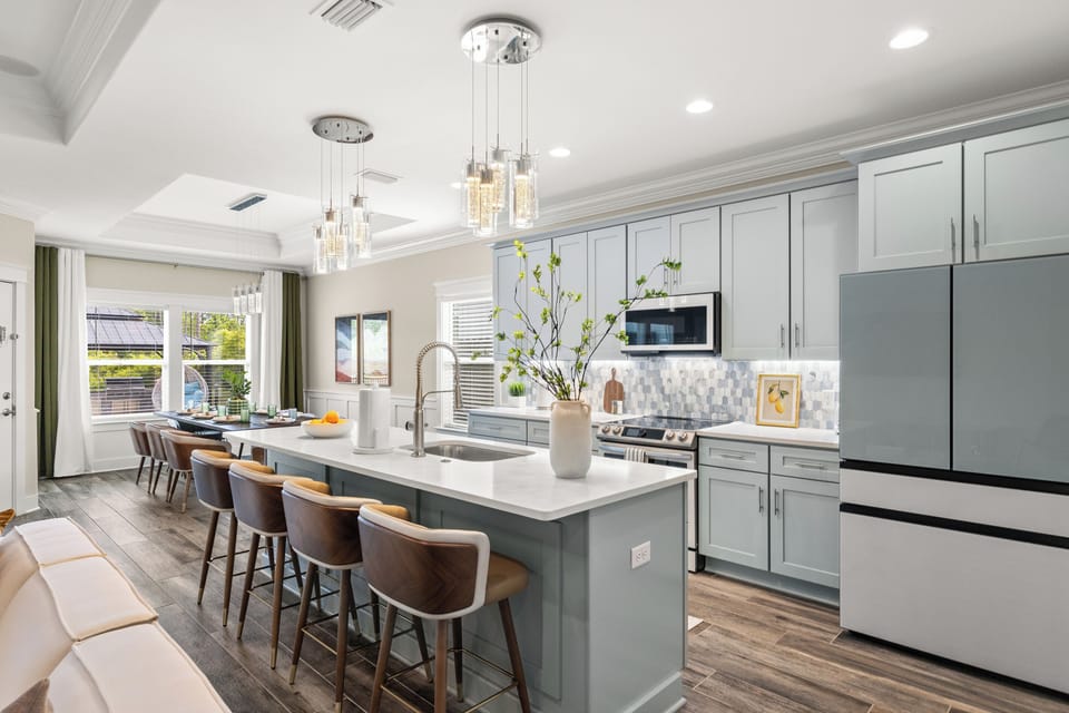 Enjoy a built-in refrigerator with filtered water dispenser, dishwasher, Samsung range with air fryer mode, toaster, blender, dinnerware for indoor and outdoor dining; and plenty of space to cook, gather, and create memorable meals together.