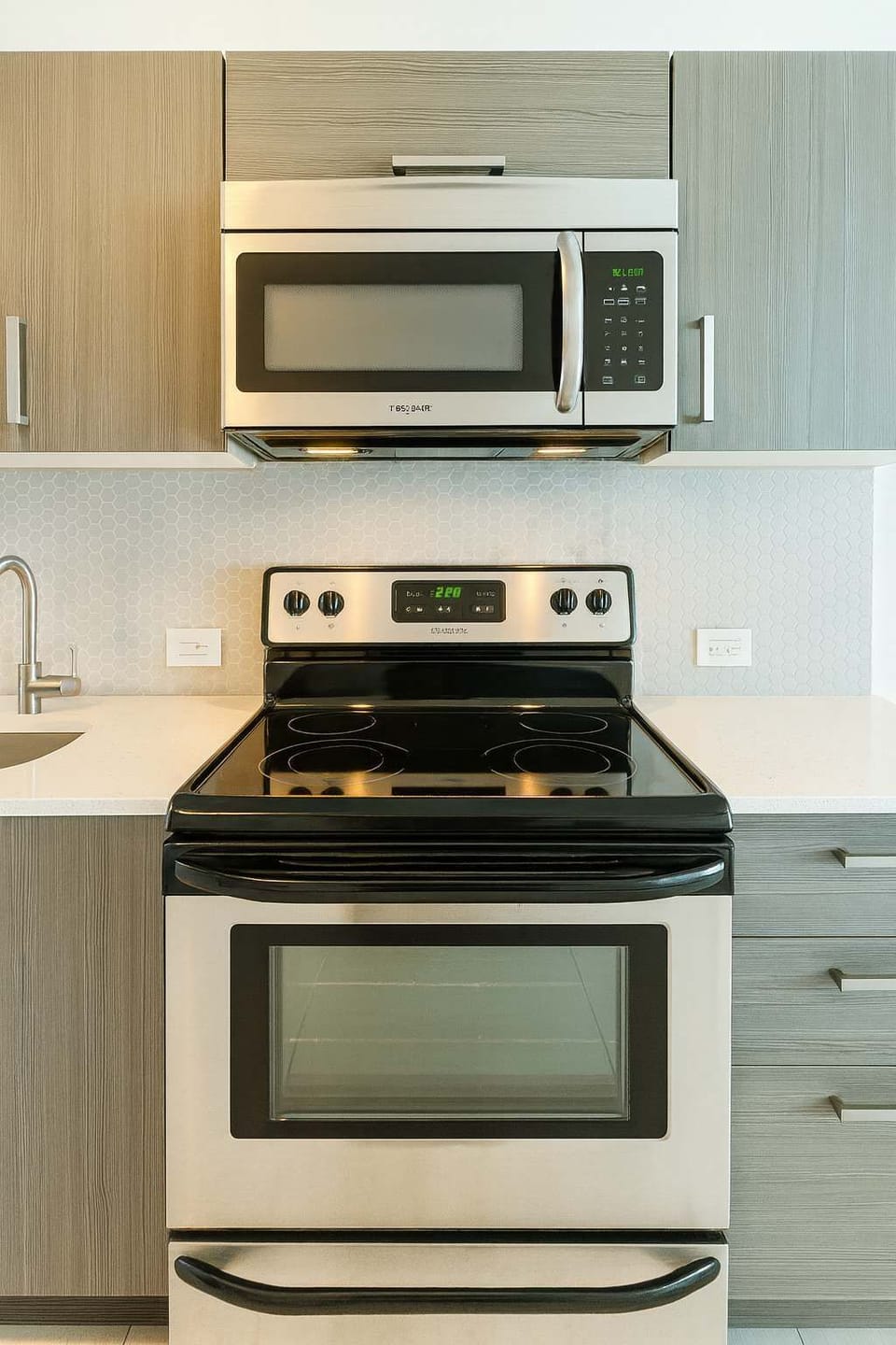 Modern kitchen with stainless steel appliances, sleek cabinetry, and a clean design—perfect for cooking your favorite meals during your stay.
