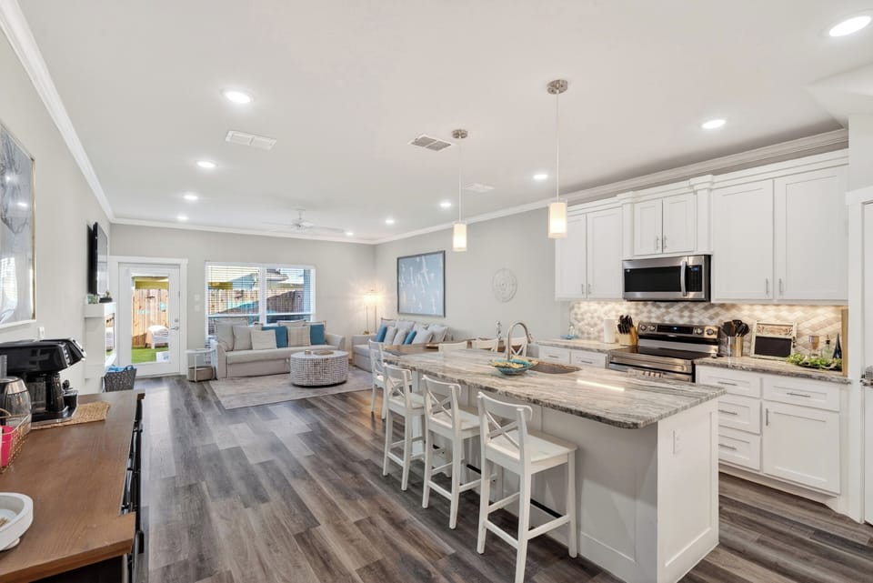 Perfect for entertaining, the great room effortlessly connects the living area, casual dining, and a gourmet kitchen.