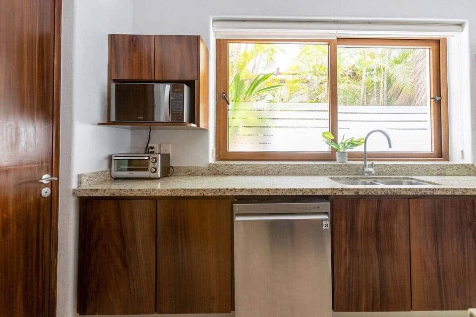 Apartment, 4 Bedrooms, Balcony, Sea View | Private kitchen | Toaster oven, freezer, paper towels, dining tables