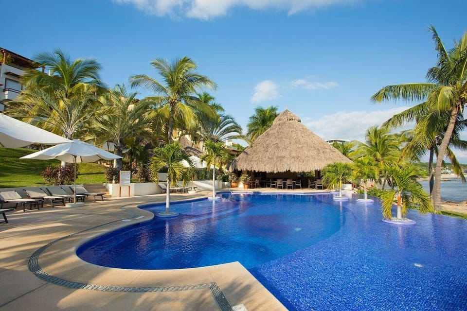 Apartment, 4 Bedrooms, Balcony, Sea View | Pool | Outdoor pool, free cabanas, pool umbrellas
