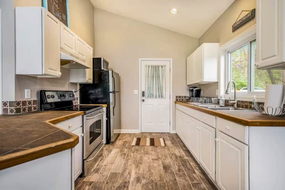 This is the Entrance to the home. Fully furnished kitchen which includes drip coffee pot and Keurig. Coffee and Condiments included. 