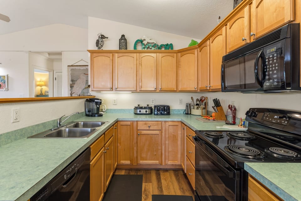 Prepare everything from quick breakfasts to family feasts in the fully equipped kitchen designed for easy vacation living.