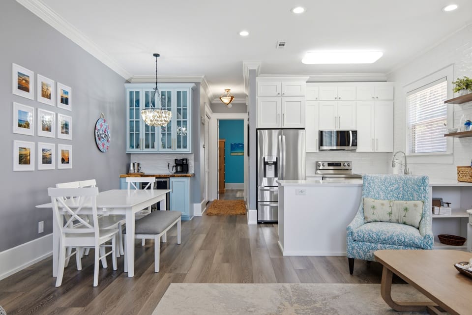 The great room open floor plan is spacious for cooking & dining with the family.
