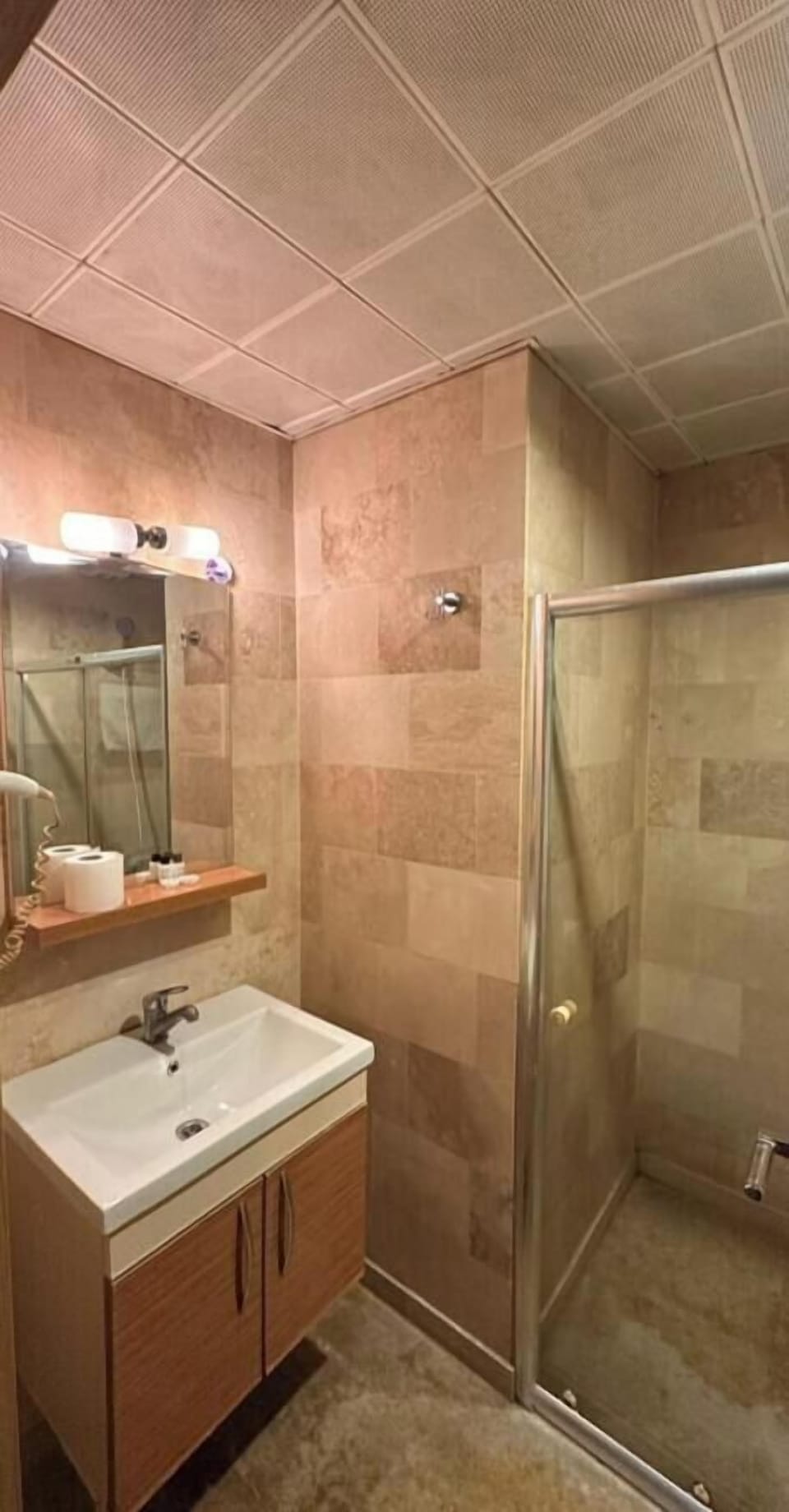 Shower, hair dryer, slippers, towels