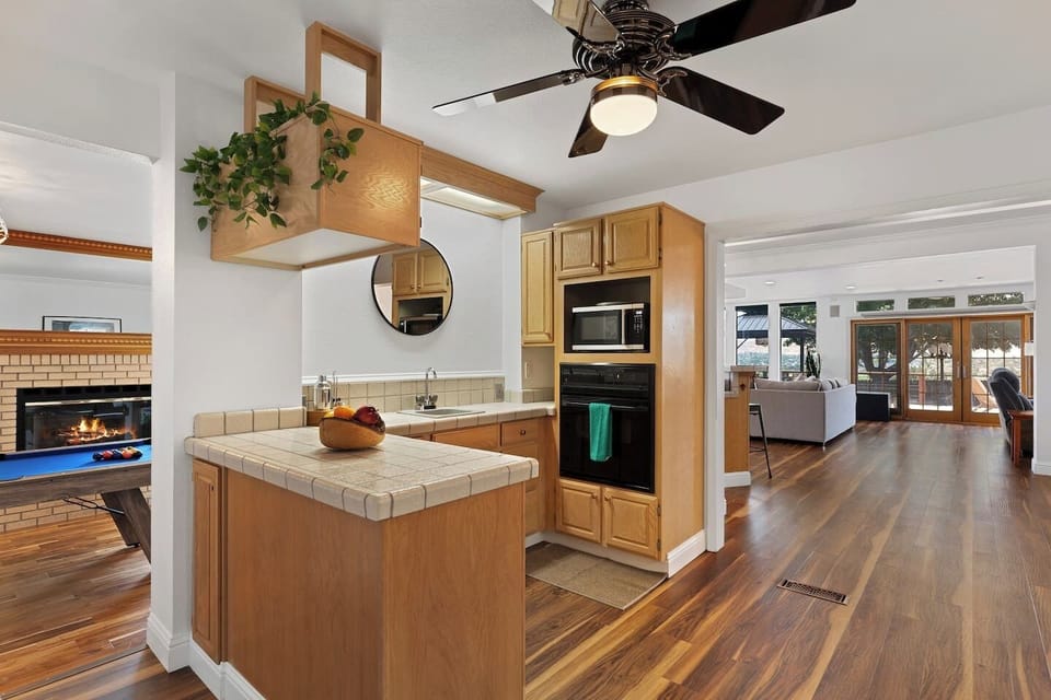 The heart of the home, this open kitchen seamlessly connects to the living areas, allowing guests to cook, socialize, and enjoy the home`s welcoming atmosphere.