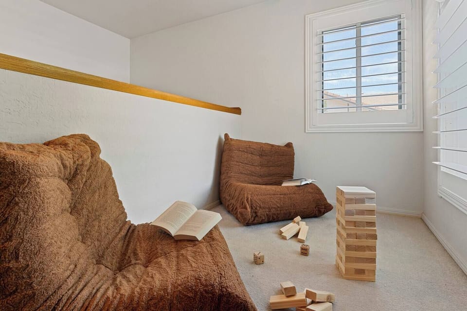 A cozy retreat designed for quiet moments, board games, and family fun. Curl up with a good book or enjoy a friendly game in this charming upstairs nook.