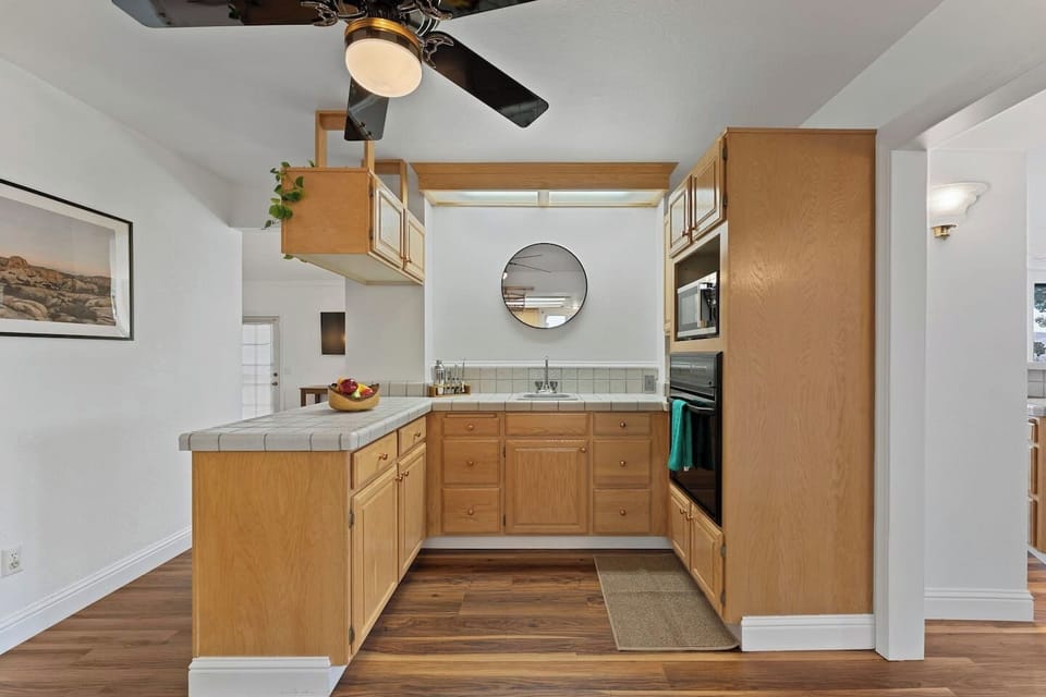 Enjoy a practical and well-equipped kitchen layout with abundant storage, generous workspaces, and everything needed to make yourself at home during your stay.